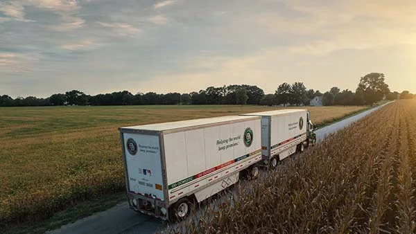 Aerial Drone shot of truck by cornfield - vertical shot